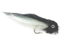 Black and white fly fishing lure with black body, white wing, and steel hook.