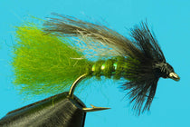 Olive emerger fishing fly with green bead and dark shaggy hackle