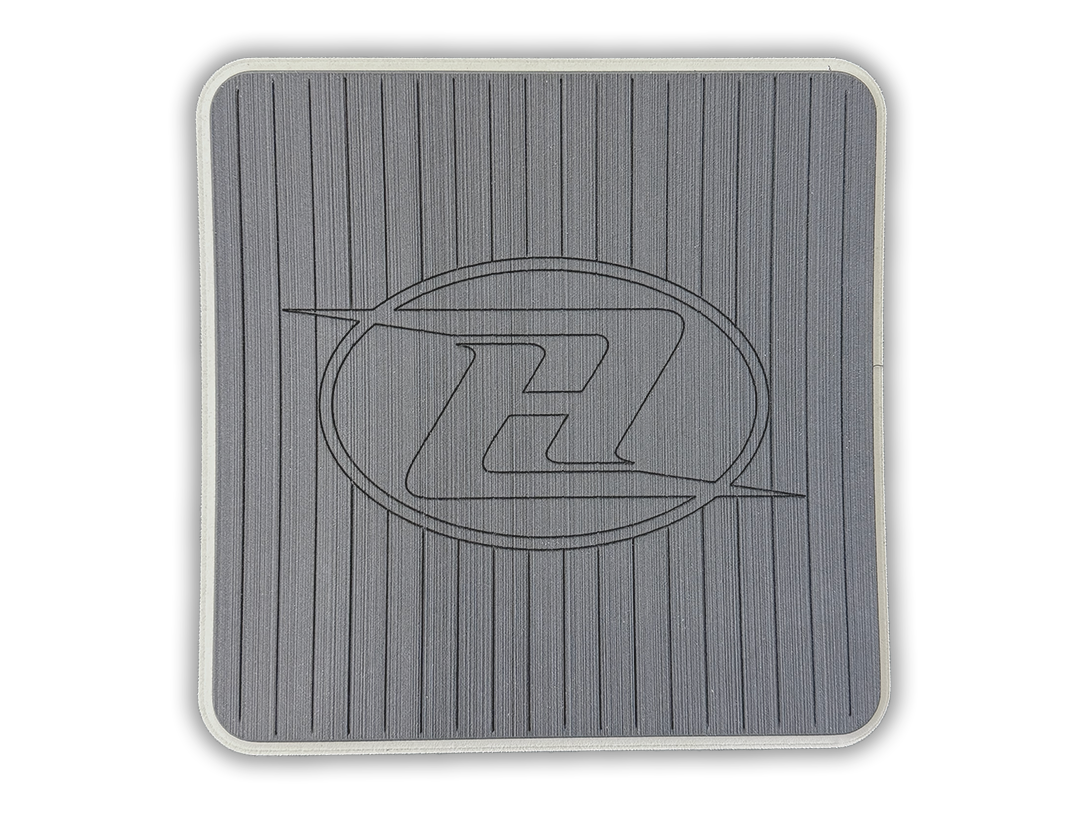 Square deck grip patch with vertical ridges and oval logo, light gray.