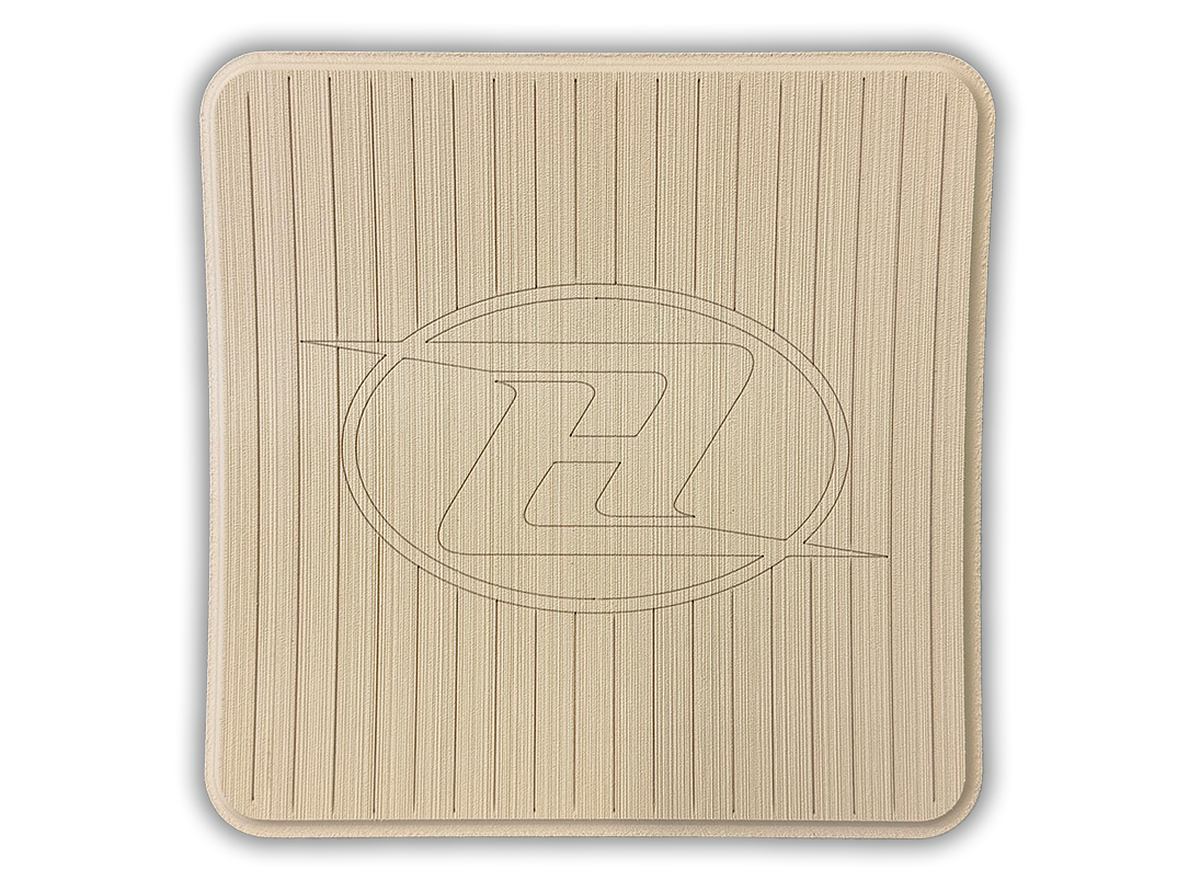 Square deck grip patch with vertical ridges and oval logo, beige/cream.