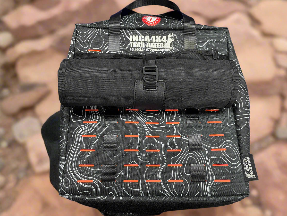 Black tool bag with patterned front, top handle, and front organizer panels