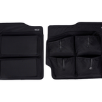 Pair of black lower rear door storage panels with multiple zip pockets