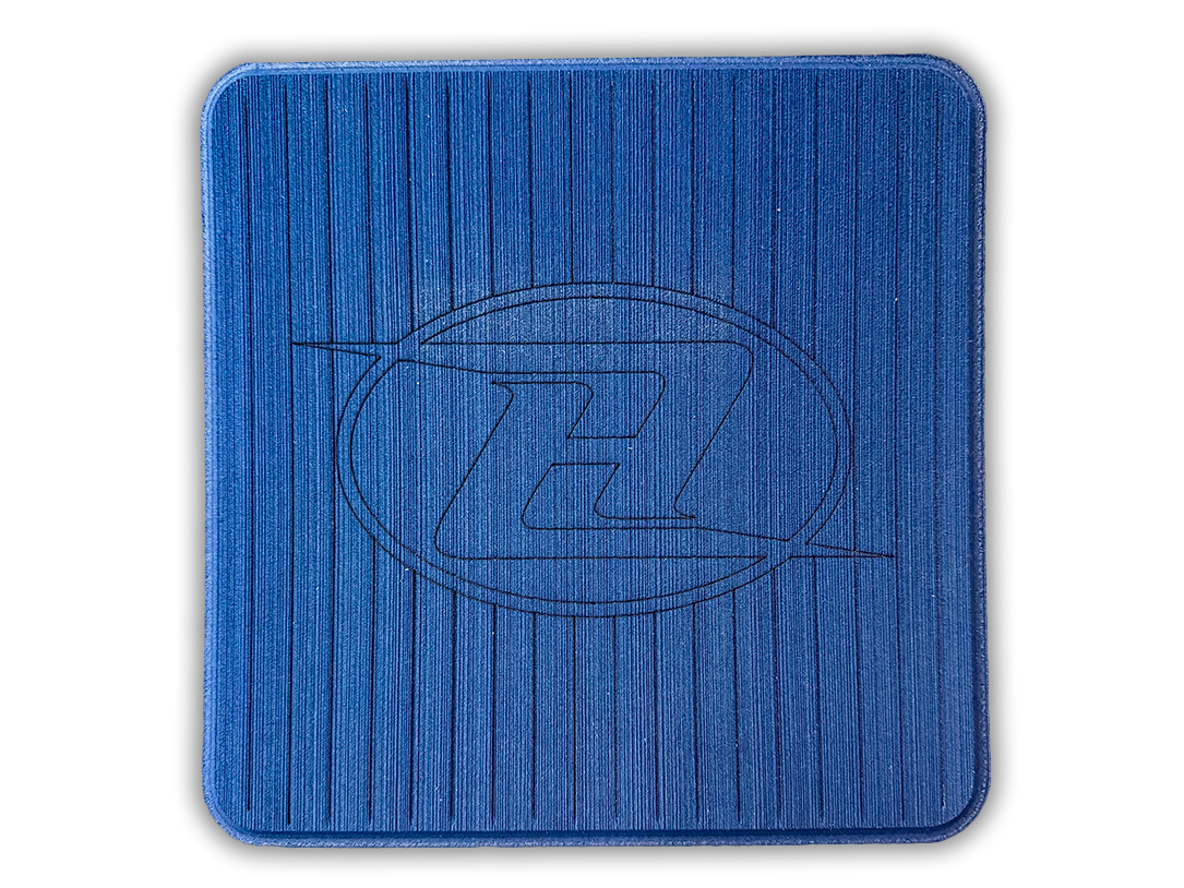 Square deck grip patch with vertical ridges and oval logo, royal blue.