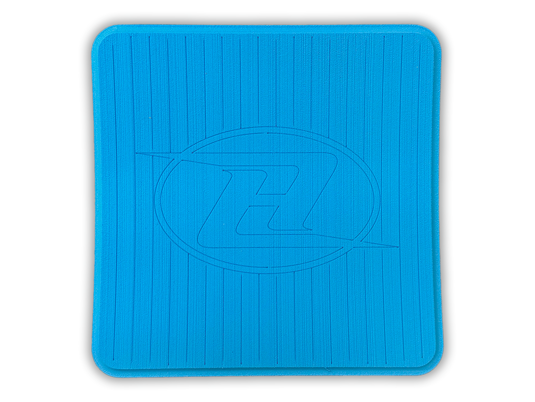 Square deck grip patch with vertical ridges and oval logo, bright blue.
