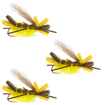 Three yellow foam hopper flies with brown bodies, yellow foam wings, and hooks