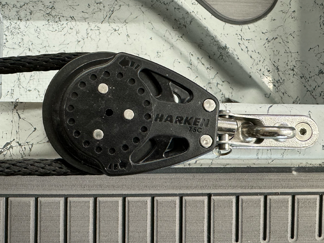 Ratcheting side-anchor pulley with black sheave, rope line, stainless hardware, HARKEN 75C