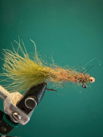 Olive balanced leech fishing fly with feather tail and speckled body