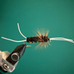 Fishing fly lure by Bitch Creek, dark fuzzy body with light wing strands