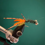 Crawfish-style fishing fly with orange body, fuzzy legs, and black wire head