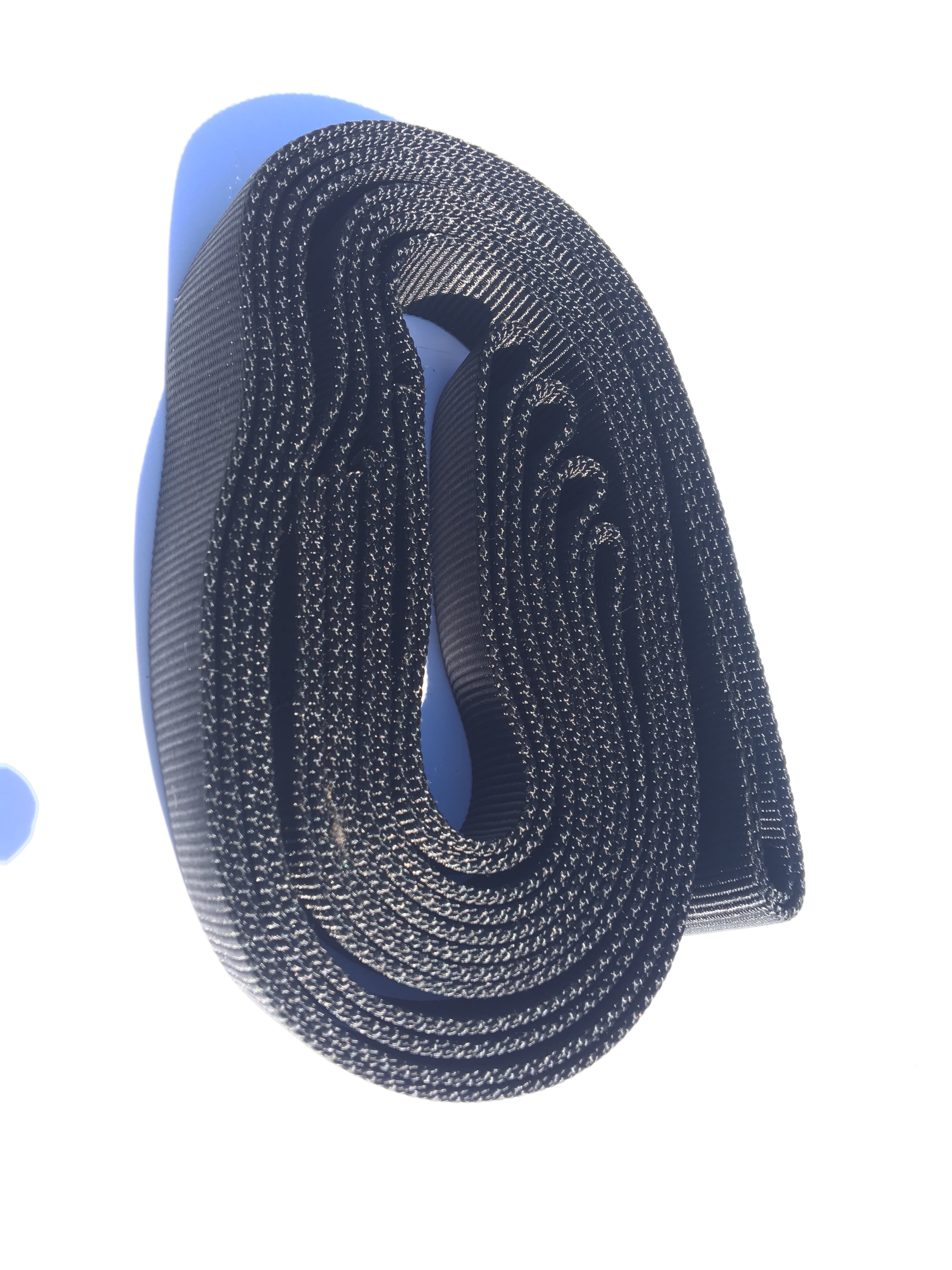 Dark navy woven recovery leash strap, coiled with looped end