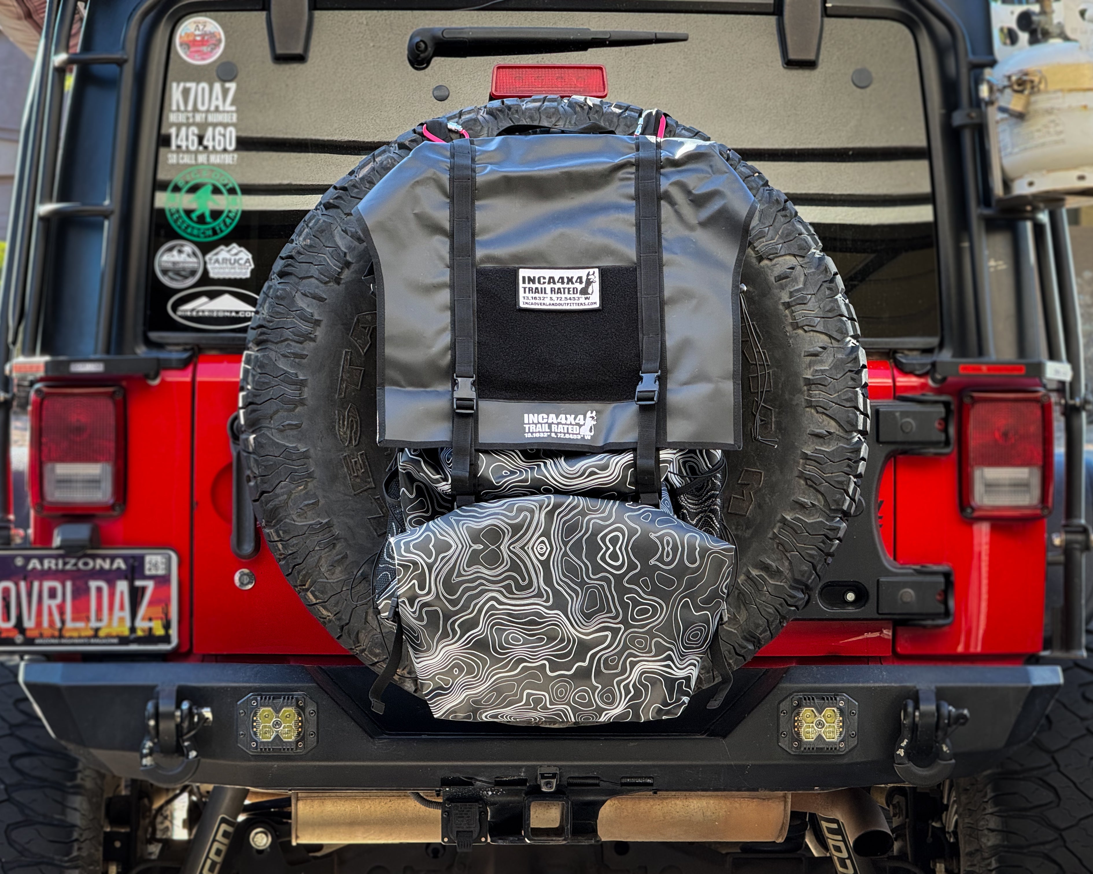Mounted spare tire tailgate bag in black and gray pattern with top gray straps