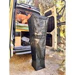 Outdoor hanging shower kit in black fabric with hanging straps and storage compartment