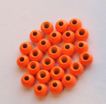 Orange round beads with center hole, glossy finish