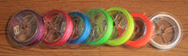 Colorful backing spools set, showing white, pink, purple, blue, green, orange, yellow, black