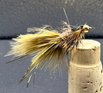 Fishing lure nymph with light yellow-brown fluffy tail and gold hook