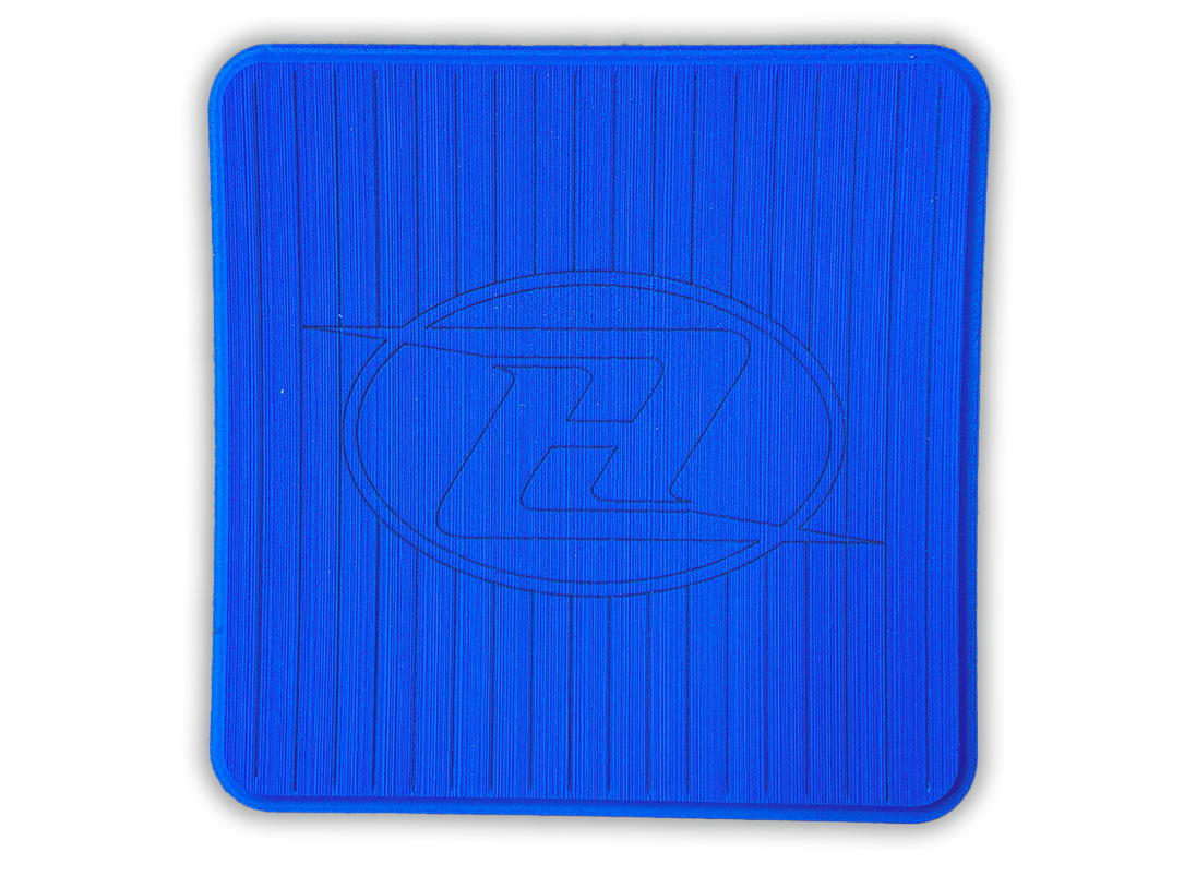 Square deck grip patch with vertical ridges and oval logo, deep blue.
