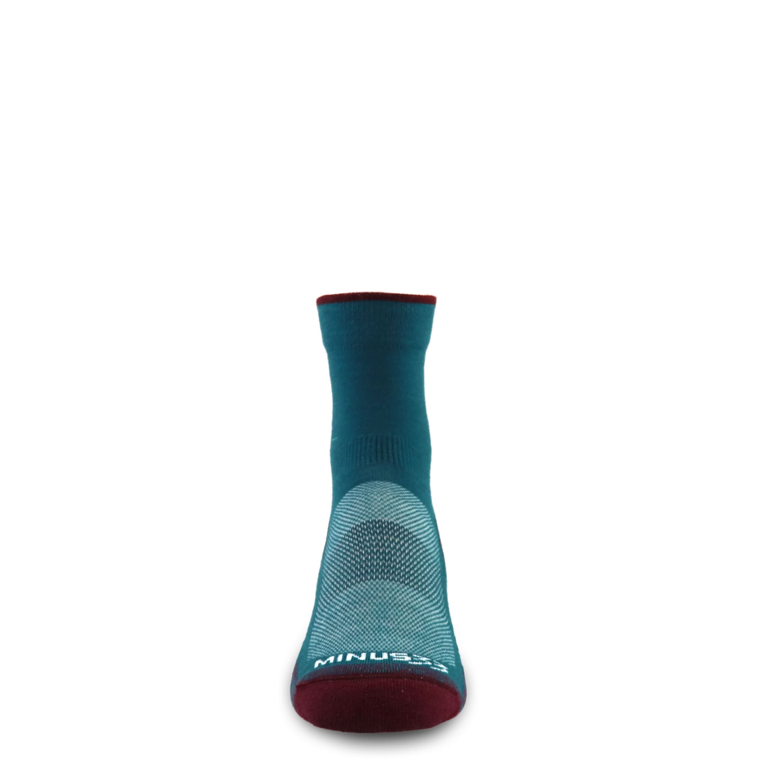 Teal mini crew socks with maroon toe and cushioned sole texture underfoot.