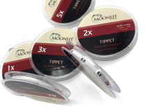 Moonlit mono tippet line spools (1x–6x) with clear dispenser