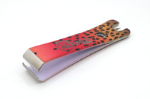 Fishing line nipper with eye cleaner, colorful fish-skin handle (close-up)
