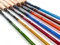Assorted colored fiberglass fly rods with cork handles, shown side by side