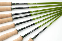 Green fiberglass fly fishing rod with cork handle and black reel seat