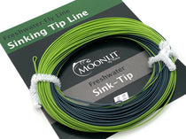 Green and dark sink-tip fly line on card with white leader loops