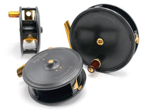Fishing reel set with two dark gray spools, gold accents and side mounting bracket