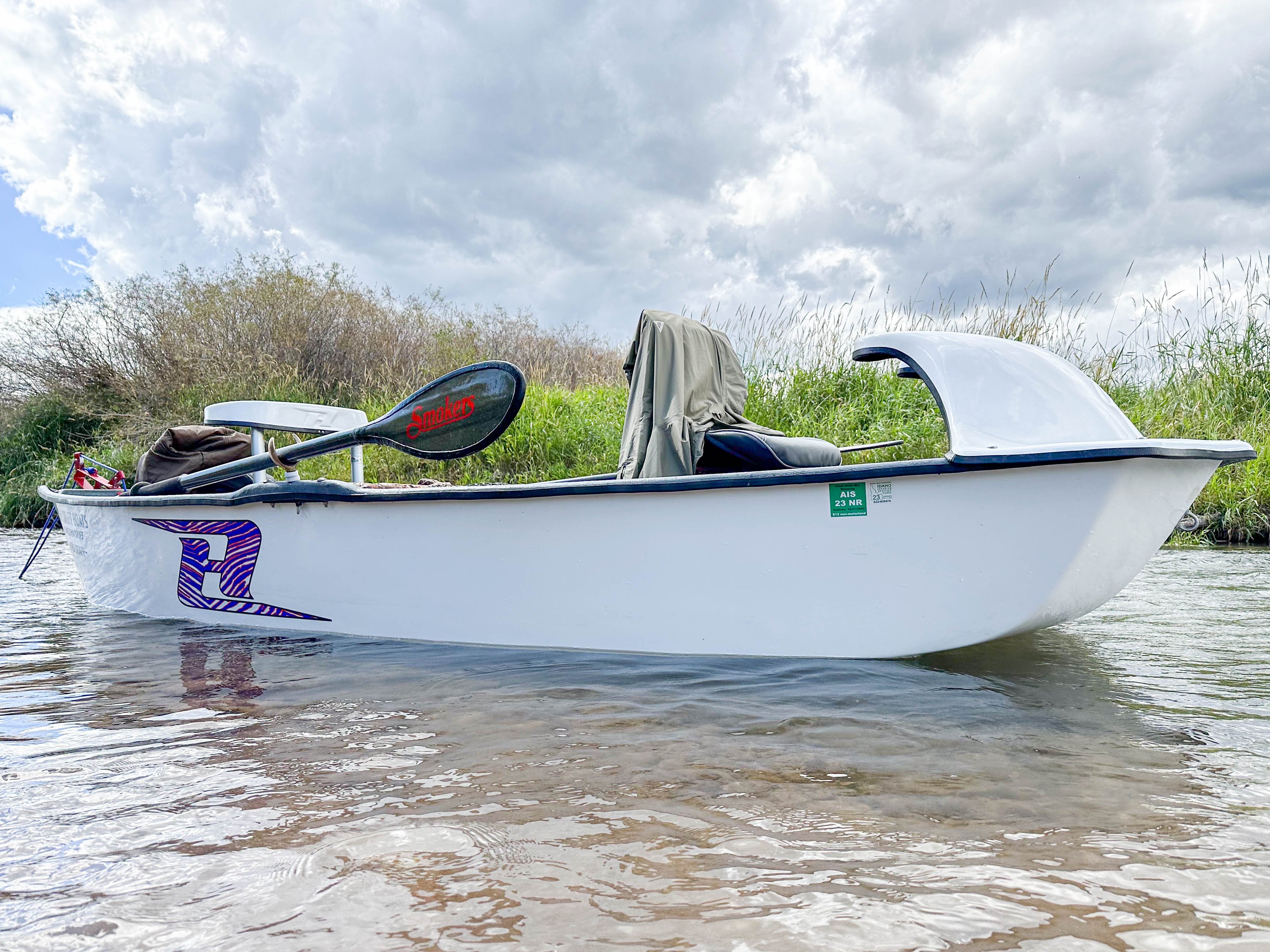 Kayak with Smoker Bandit paddles; black blades with red logo accents