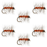 Orange and black dry fly with white wing fibers and barbless hook, size 18