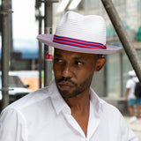 Lavender paper braid hat with multicolor striped band worn by model