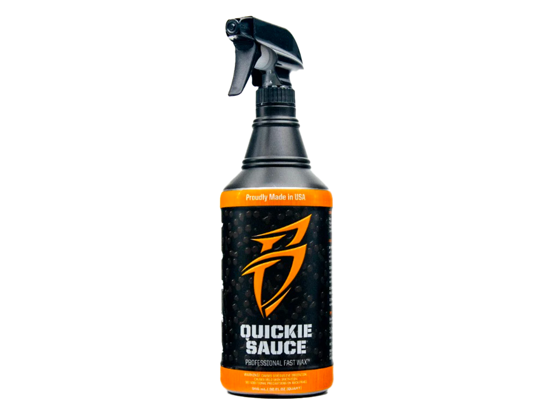 Car wax spray bottle with trigger sprayer, dark bottle and orange label.