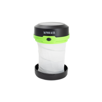 Pop-up solar pocket light standing upright with white diffuser and black top, neon green ring.