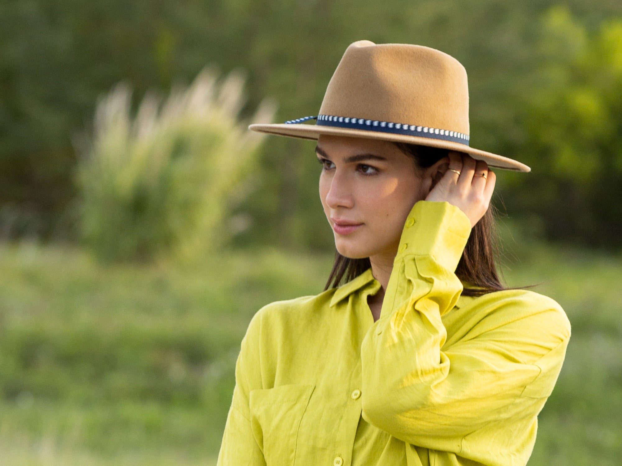 Merino wool felt hat in camel on model, with blue band and bow detail