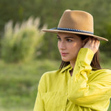 Merino wool felt hat in camel on model, with blue band and bow detail