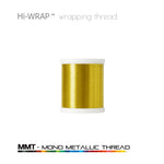 Metallic wrapping thread spool, gold mono metallic thread on a white base