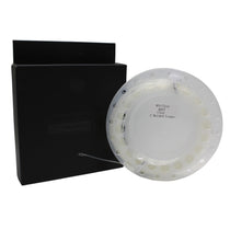 Clear intermediate sinking fly line on translucent round spool, with label and backing card.