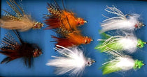 Crab-style feather fishing lures with orange, green, and white accents