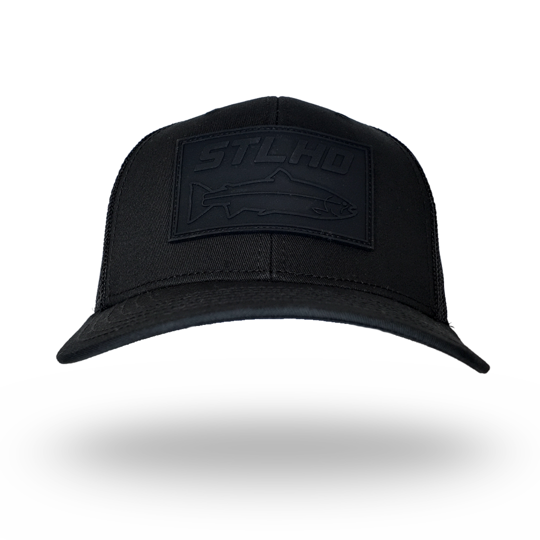 Black trucker cap with STLHD logo patch on the front, top view