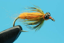 Carp soft hackle fishing fly with orange body and yellow-green feather hackle