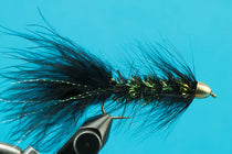 Conehead Crystal Bugger fishing fly: teal-blue feathers, gold conehead, sparkle