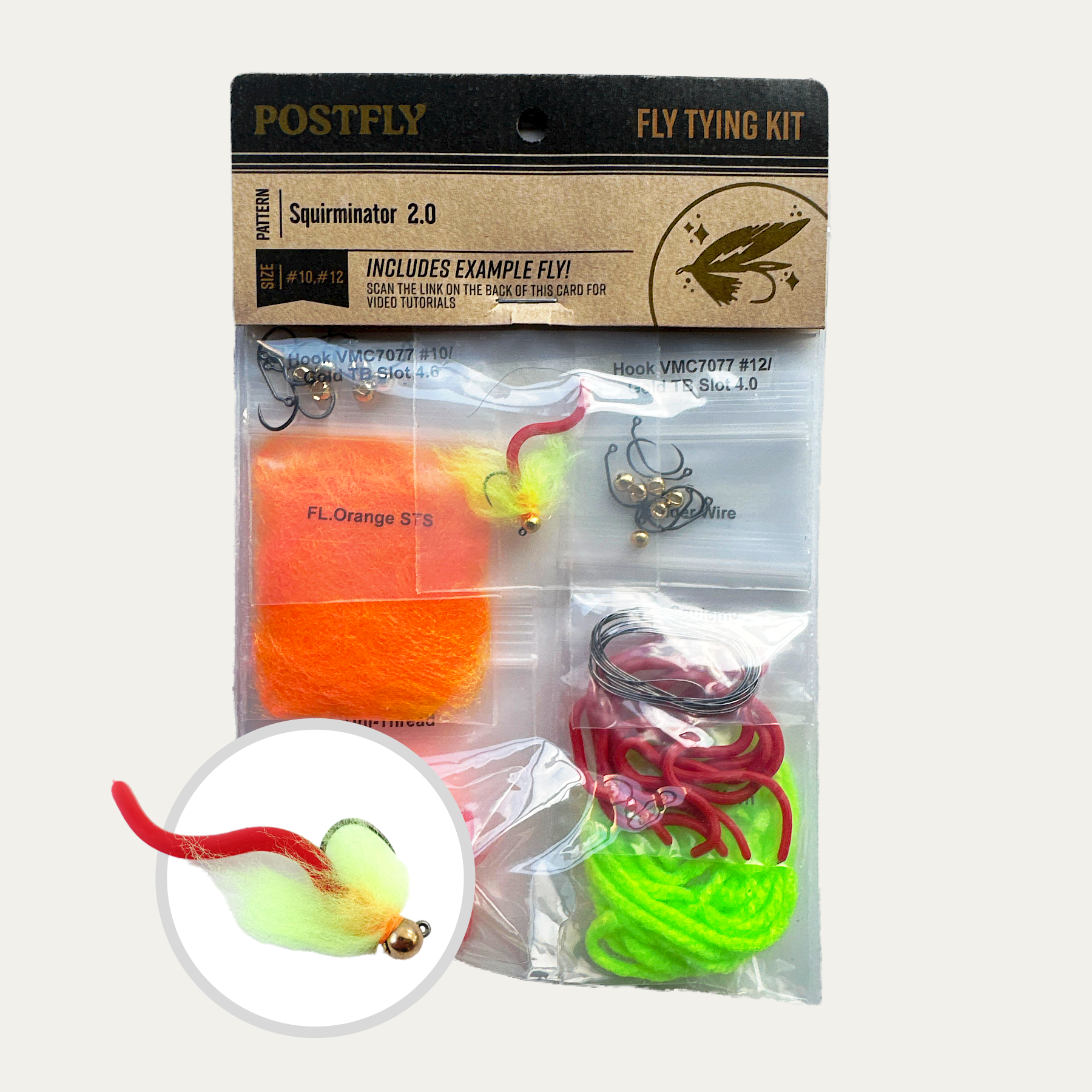 Fly tying kit in blister pack with hooks, orange foam, green chenille, and thread accessories