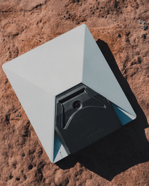 Portable power base with white top and black battery module, open tray view