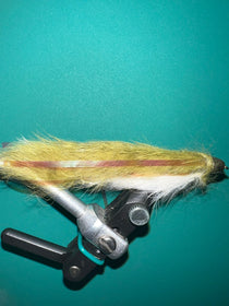 Olive-and-white double llama fly lure with fuzzy wings and metal hook shank