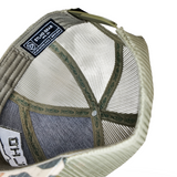 Inside view of camo trucker cap showing mesh lining and adjustable strap