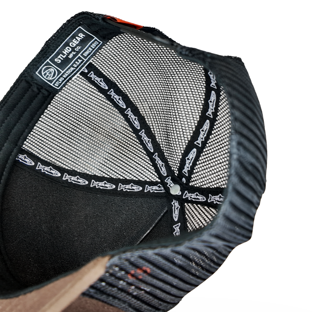Black mesh trucker cap with inside label and patterned lining