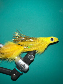 Chartreuse and olive streamer fly with yellow feather tail and black bead eyes