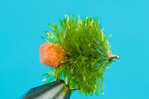 Green fuzzy fly lure with orange accent tuft on metal hook