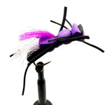 Novelty foam fly fishing lure with purple foam body, white tuft, and black legs