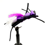 Novelty foam fly fishing lure with purple foam body, white tuft, and black legs