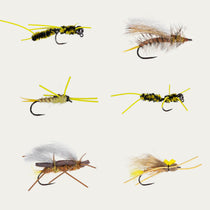Barbless fly assortment with six yellow-and-brown nymph and streamer patterns on hooks